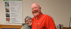 Dexcomm owner hugging an employee