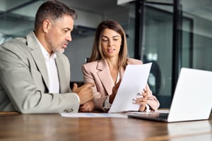 Two lawyers looking over a document