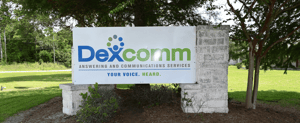 Dexcomm Ansering and Communications sign at Carencro office
