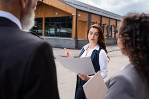 Property manager explaining something to clients